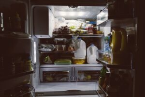 declutter your fridge, this one is crowded with milk and grapes
