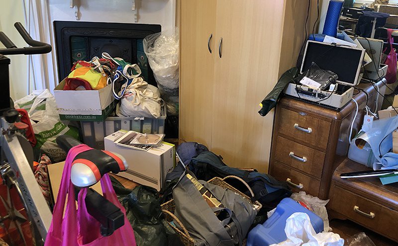 why do we clutter - bags and piles of stuff in a room
