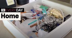 Typical junk drawer with a tangled mess