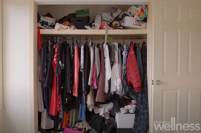 Laura's wardrobe before, looking messy