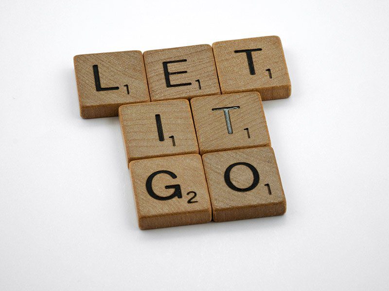 Decluttering and regret - tiles say Let it Go