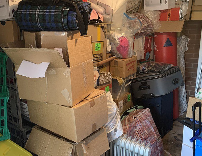 Decluttering a Storage Unit - towering boxes