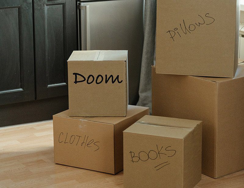 A Doom Box among other cardboard boxes
