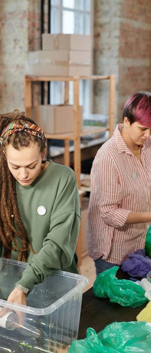 Declutter and organise sustainably - workers sort recyclables