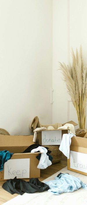 Declutter your house - boxes labelled keep, donate, trash