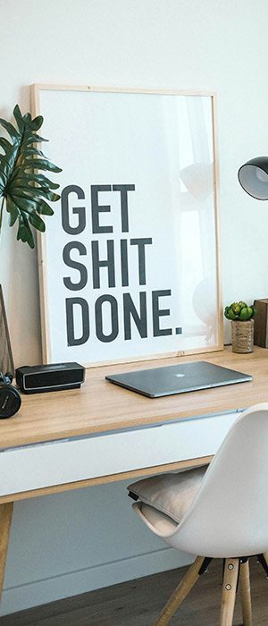 Office and paperwork​ - a neat office with a Get Shit Done sign