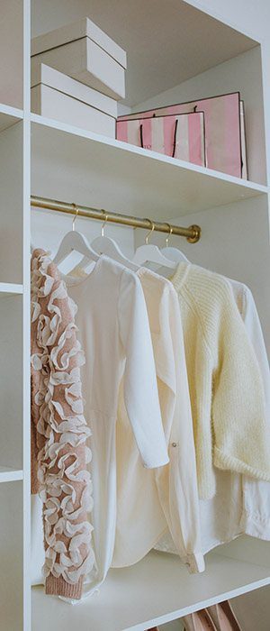 Wardrobe makeover - a neat row of clothes and a few boxes